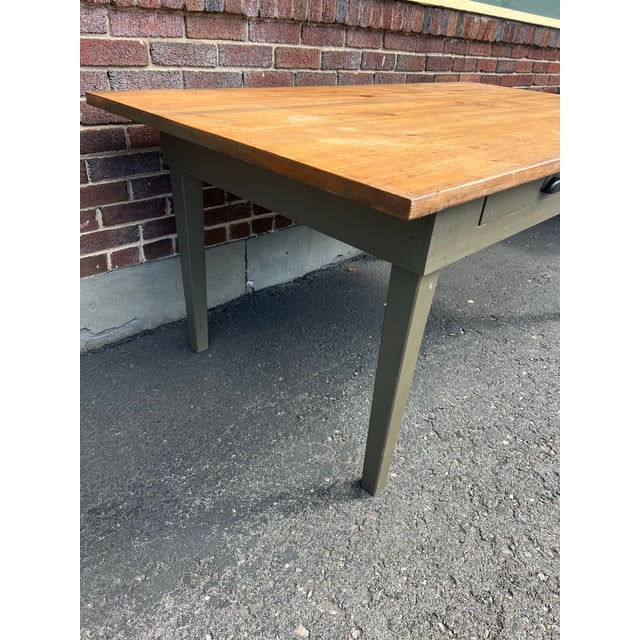Vintage Farmhouse French Style Table with painted base and legs with wood table top. This is a vintage used table with...