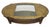 Oak oval shaped coffee table with a cutout glass center and four post legs. The second shelving level has a caning...