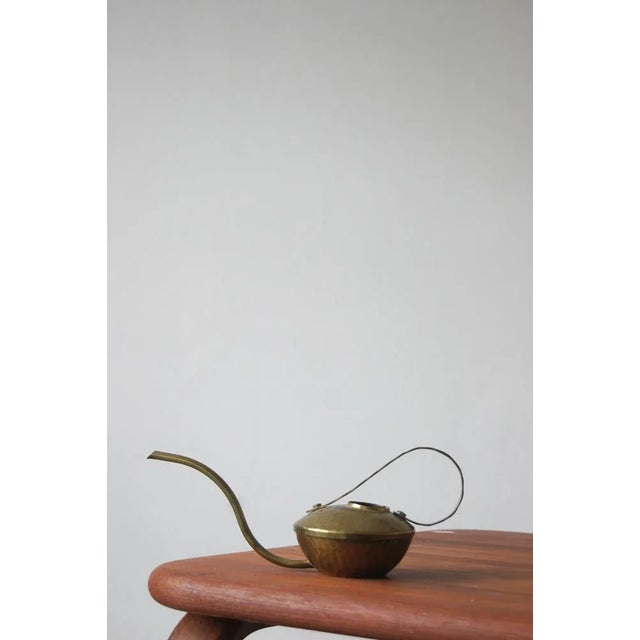 The watering can was handcrafted from the highest quality brass in the 1950s. It has a comfortable, large handle and a...