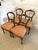 Set of four quality antique Victorian carved walnut dining chairs having a quality solid walnut carved back shaped seat...