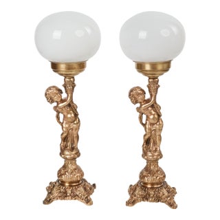 1950s Spanish Neo-Classical Cast Brass Cherubs / Putti Table Lamps With Opal Glass Shades - A Pair For Sale