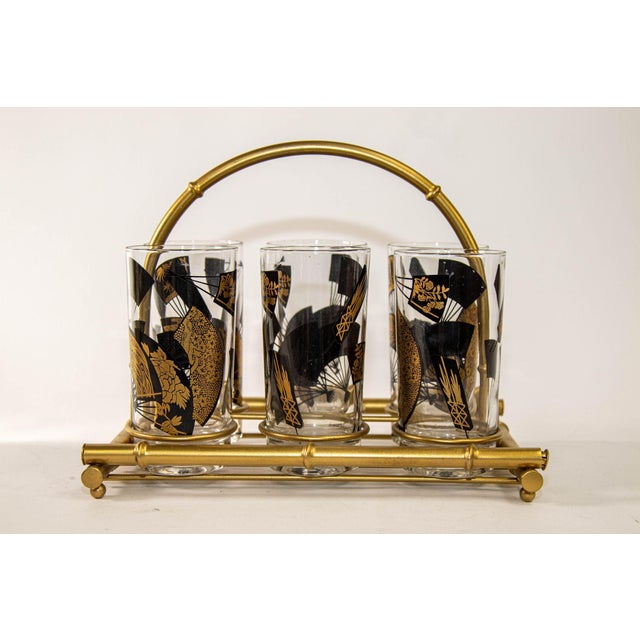 Set of Six Jules Jurgensen Black & Gold Highball Glasses with Faux Bamboo Carrier, circa 1976 An elegant and highly...