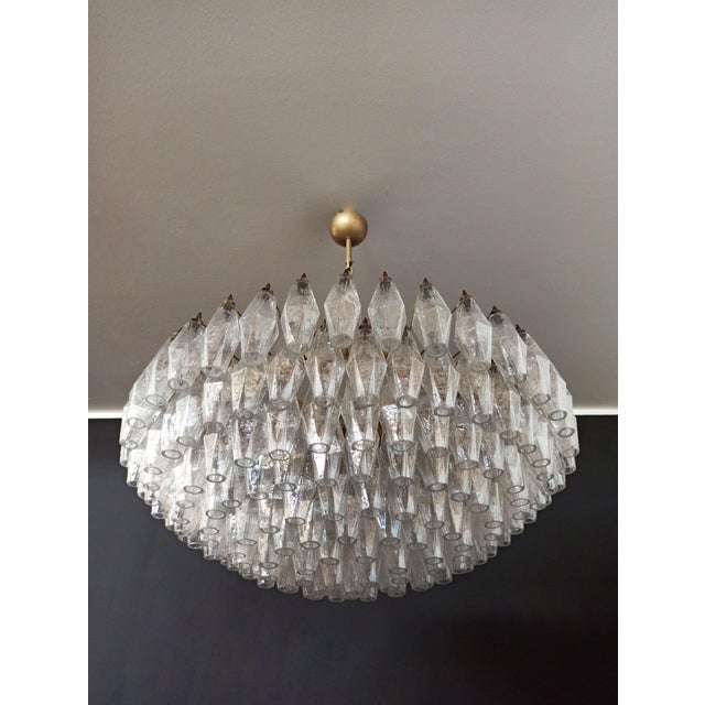 Elegant Italian pendant light made from 185 iridescent glasses "poliedri". Structure in gold and brass colored metal....