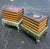 A charming and highly decorative pair of vintage faux book storage end tables dating to the mid 20th century. Designed to...