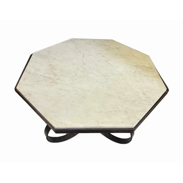 Pair of mid century wrought iron side tables with six sided marble tops.