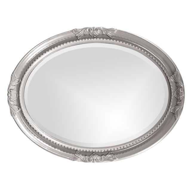 The Queen Ann Mirror features a glossy nickel lacquer finish. The oval frame is made from wood and is accented with a...