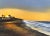 Experience the glow of an autumnal sunrise in the California coastal town of Carpinteria in this 7x5 inch miniature oil...