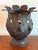 Vintage Hollywood Regency style metal leaf cachepot or planter/pillar candle holder. It is constructed from patinated,...