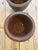 Early 20th century hand thrown rimmed terra cotta planters. Deep rich patina.