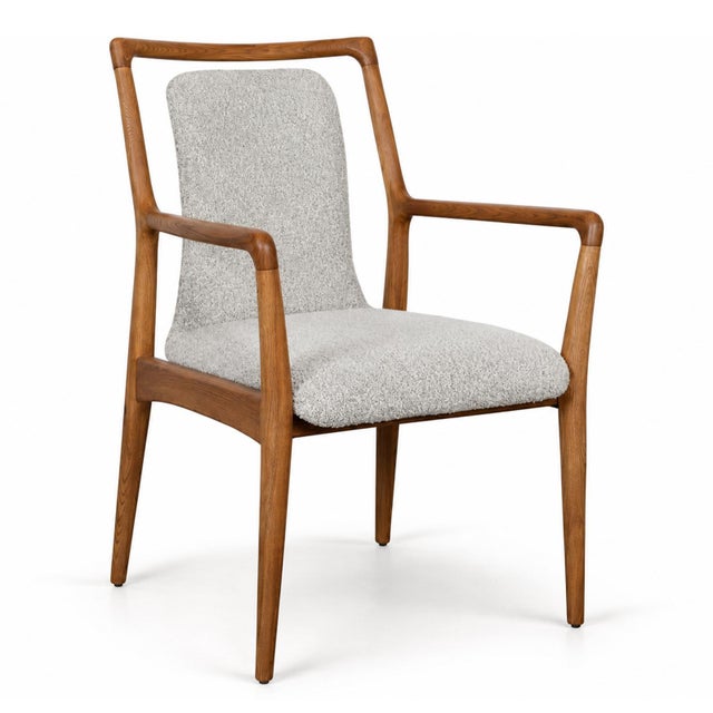 Midcentury inspired smooth wood frame dining arm chair with light grey and cream upholstered seat and floating back. Seat...