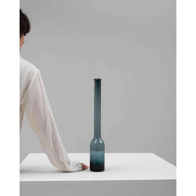 This 20th-century Italian glass vase is a striking example of minimalist elegance. Crafted from hand-blown glass, it...