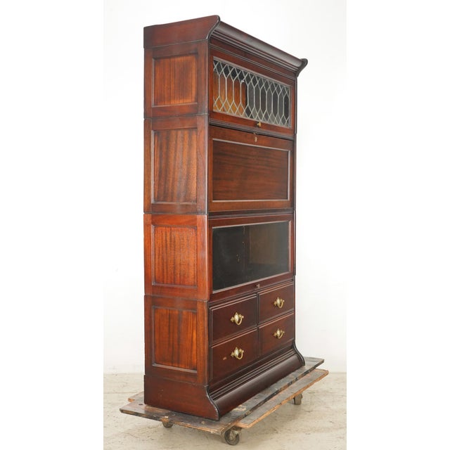 Victorian style barrister bookcase with diamond paned leaded glass, a hinged writing bureau, another storage compartment,...