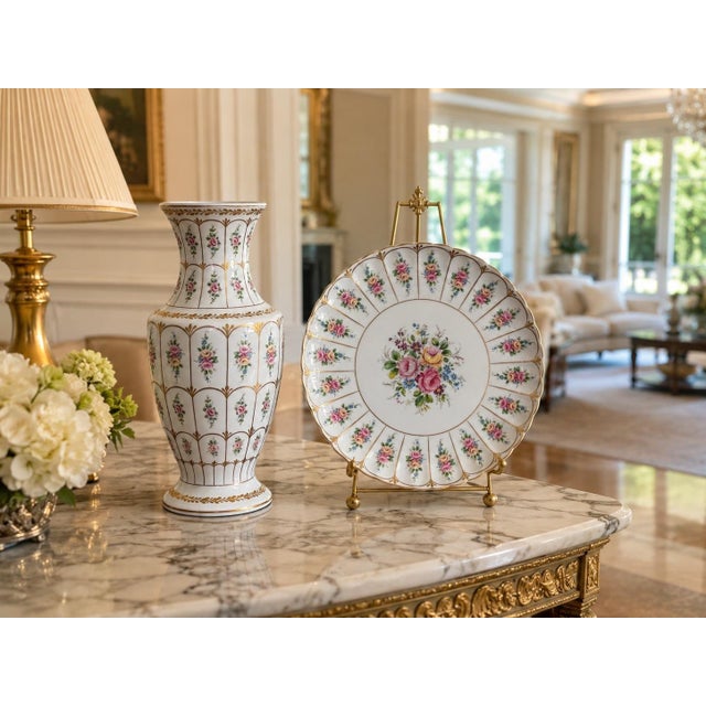 An elegant and highly decorative matching French Limoges porcelain baluster vase and cabinet charger, beautifully hand-...
