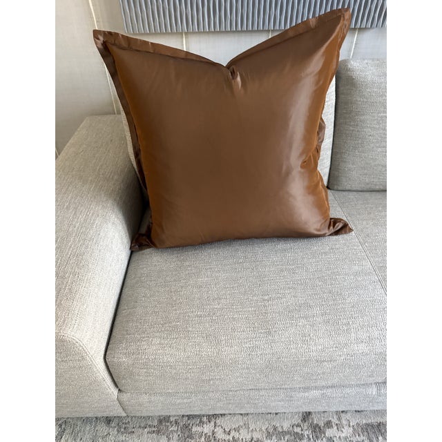 A pair of 26 inch brown silk pillows