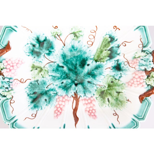 A lovely antique 19th-Century French majolica footed grape leaf platter or dish, circa 1880. This beautiful platter has a...