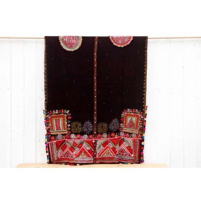 A captivating vintage Rabari throw, directly sourced from Gujarat, India, is a unique piece that tells a story. Hand-woven...