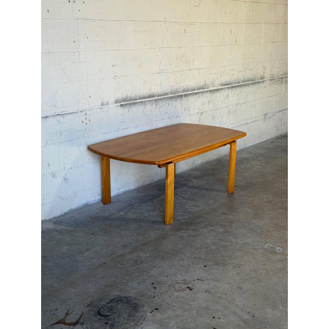 This oak coffee table features a clean rectangular top supported by sturdy square legs with distinctive finger-joint...