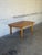 This oak coffee table features a clean rectangular top supported by sturdy square legs with distinctive finger-joint...