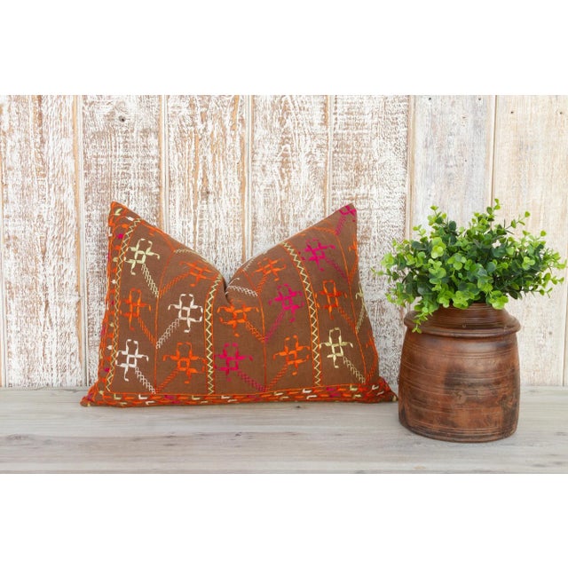 This colorful and luxurious Bagh Phulkari pillow features beautiful hand-done silk embroidery on top of a cotton fabric....