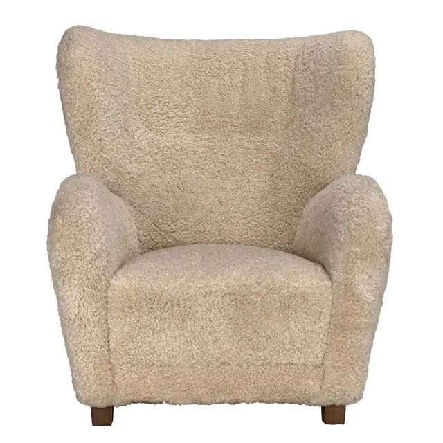 Cozy meets contemporary with the Pola Chair, wrapped in soft camel teddy fleece for a warm and inviting feel. Designed for...