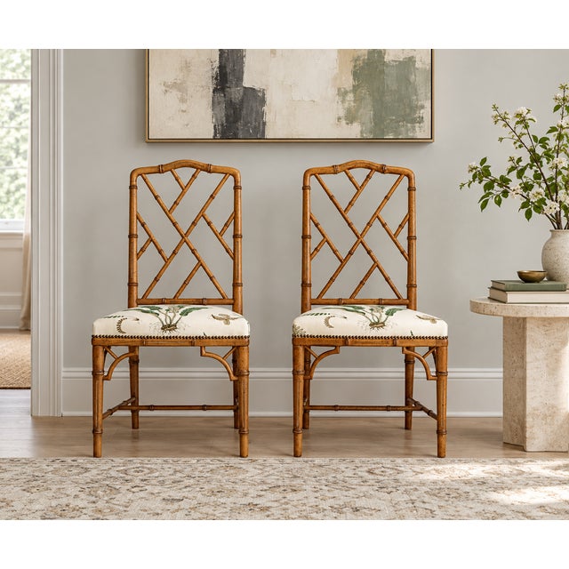 A charming pair of 1970s bamboo chairs of unknown origin, beautifully reupholstered in Ferns fabric by GP & J Baker and...