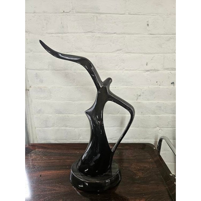 A striking example of retro minimalist art. This sleek, mid-century modern (MCM) style ceramic sculpture features a highly...