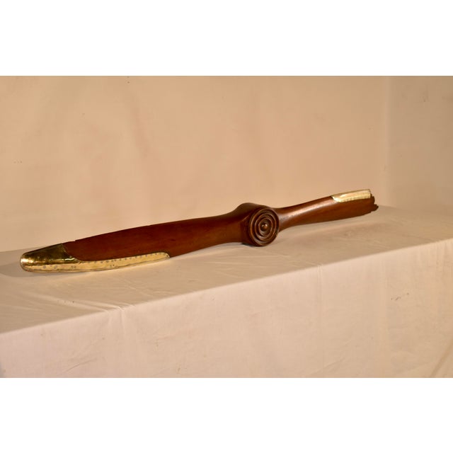 WW2 era Cresent No 17 mahogany propeller with brass tipping. This piece came down through a family out of Texas, and it...