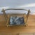 Stylish and functional mid century brass plated magazine rack. Can also be used to store logs. Nice and sturdy with...