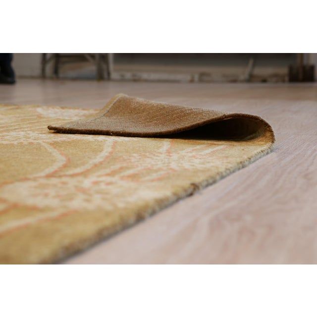 Lila Jasmine Brown Hand Knotted Wool Rug, Country of Origin: China. This exquisite piece showcases the evolving artistry...