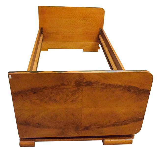 An Art Deco-style bed, made in the 1920s–1930s. The piece is distinguished by its geometric form and harmonious...