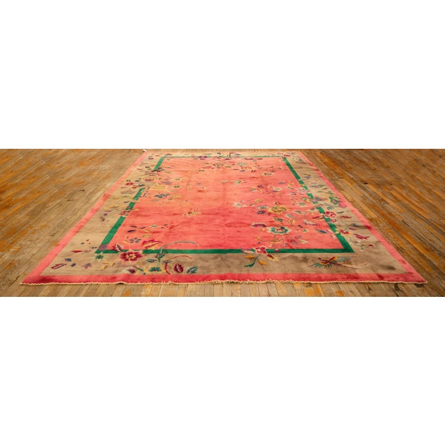 A stunning room-sized Antique Chinese Art Deco carpet, circa 1920. Measuring 8' 10" x 11' 5", this piece features a...
