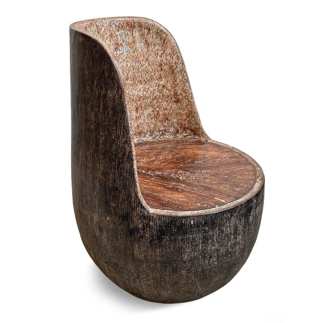 Solid coconut palm hand carved sculptural vintage chair. Celebrating the natural density and dramatic grain of the...