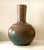 A beautifully expressive vintage studio pottery vase distinguished by its sculptural proportions and richly layered,...