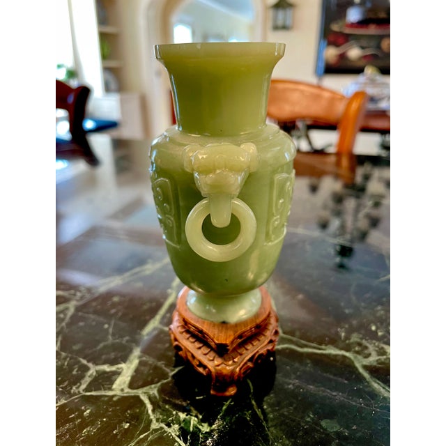 Small Chinese urn-shaped jade sculpture with lid on a decorative stand. Purchased in Hong Kong in 1990s.