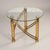A striking pair of vintage brass-finished metal and glass side tables featuring sculptural curved stretchers and spiral-...