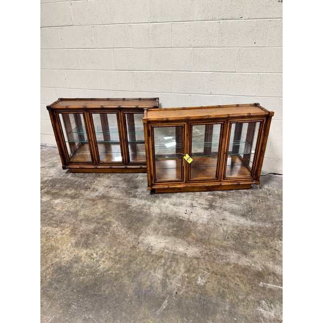 Great pair of hard to find faux bamboo mirrored back, lighted, glass shelf and doors cabinets! All the things! Very good...