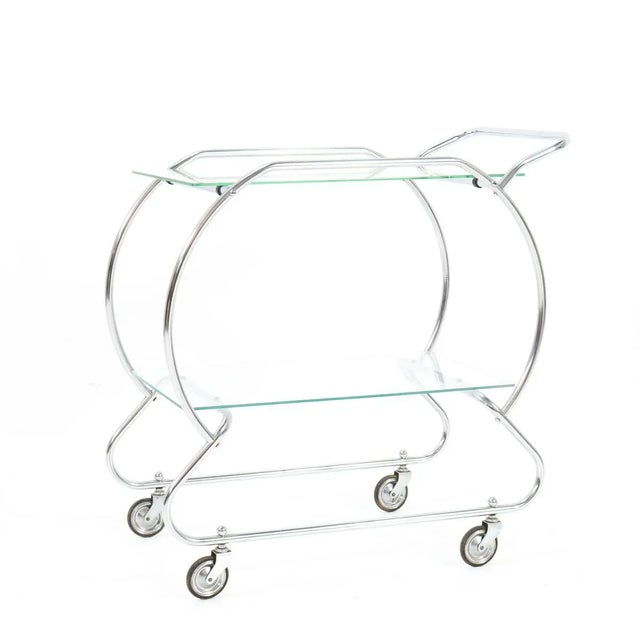 Stunning Art Deco serving trolley. Striking Dutch design from the 1930s. Nickel-plated brass with glass top and bottom. In...