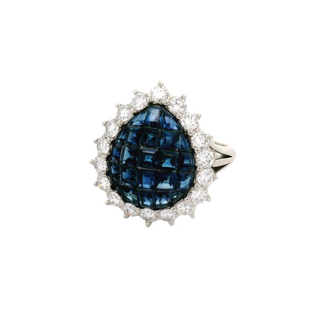 A striking and sophisticated fashion ring featuring 2.00 carats of fancy blue sapphires. The sapphires are set in a...