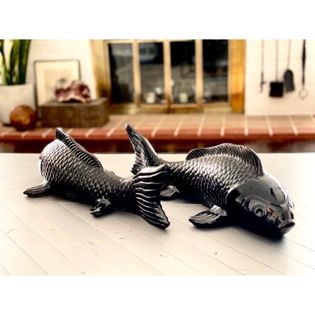 Nestor Koi Fish by Made Goods in smoky resin is a modern replica of the Japanese bred carp fish. Retails: $1080.00...