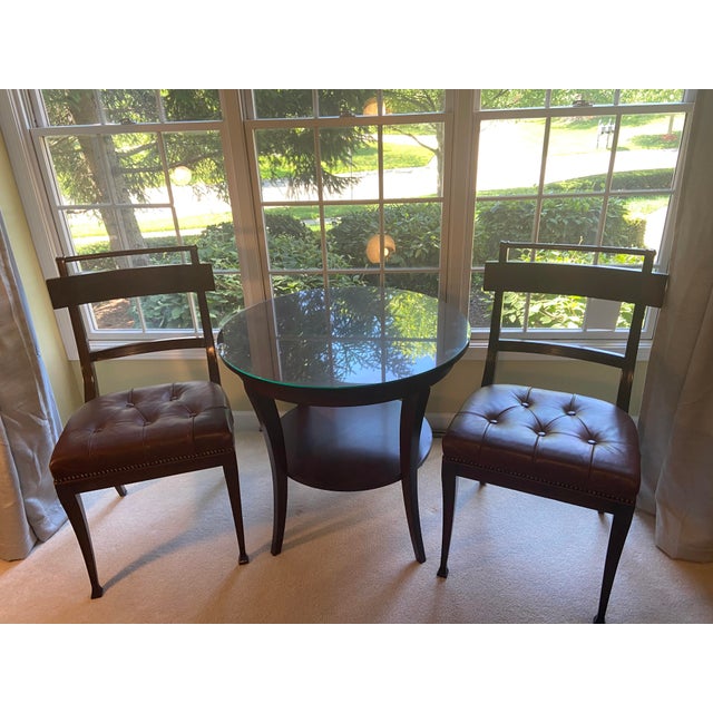 Pair of rich mahogany timeless dining chairs from Henderson’s Aquisiton Collection. Channeled frame of long mahongany...