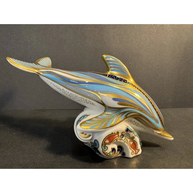Add a touch of classic English elegance to your collection with this Royal Crown Derby “Striped Dolphin on Wave” Figurine....