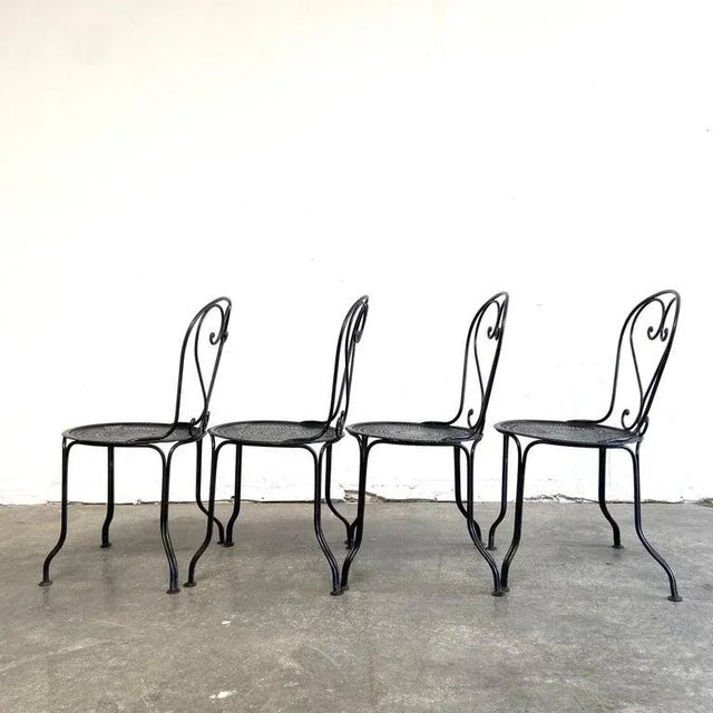 Set of 4 outdoor French iron dining chairs in black. Overall each chair is in good condition, very solid and sturdy can be...