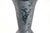 1920's black trumpet shape vase with ornately etched with birds of paradise flying above gardens. Maker attributed to...