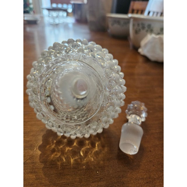 Beautiful Mid Century Modern Fenton clear glass perfume bottle with milk glass tipped hobnails.
