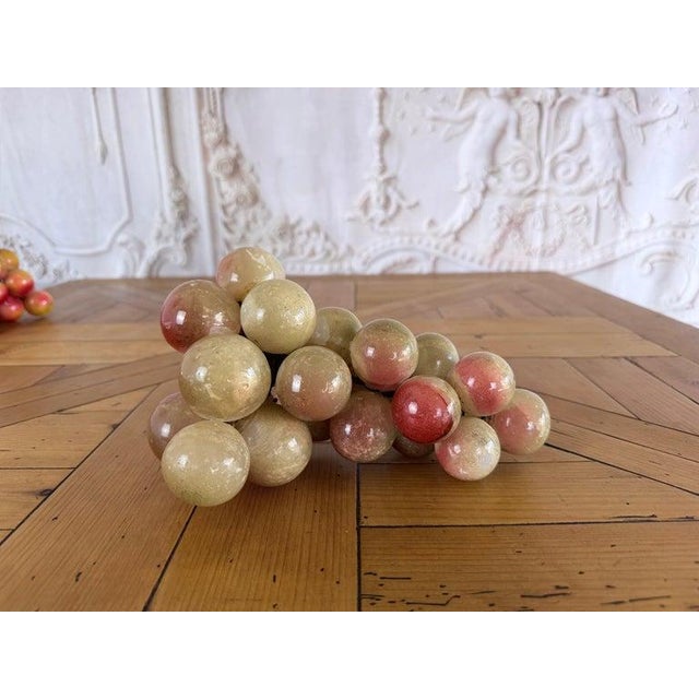 Vintage Italian alabaster grape cluster sculpture, mid-20th century. This decorative objet features dozens of hand-csrved...