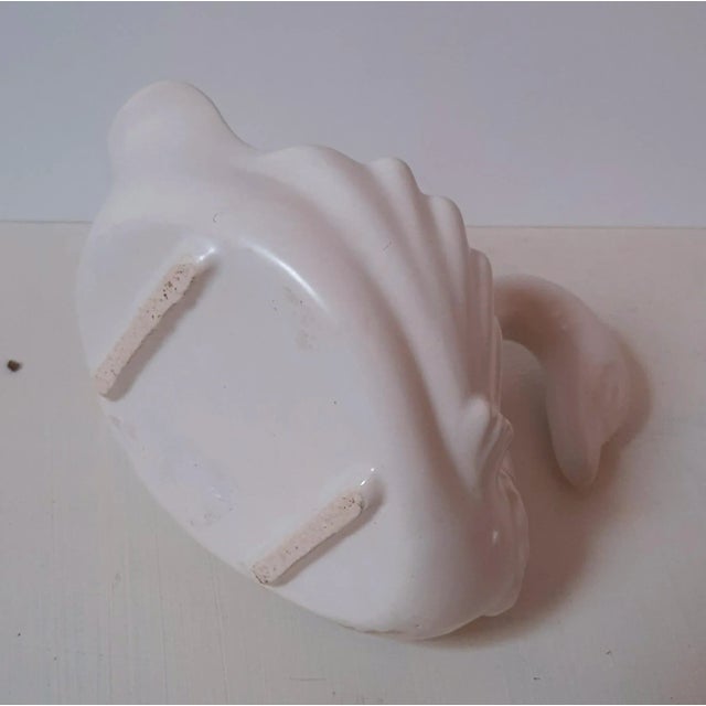 Gorgeous pure white ceramics, signed and numbered, from the USA's Hull Pottery Company, dating back to the 1950s. This...