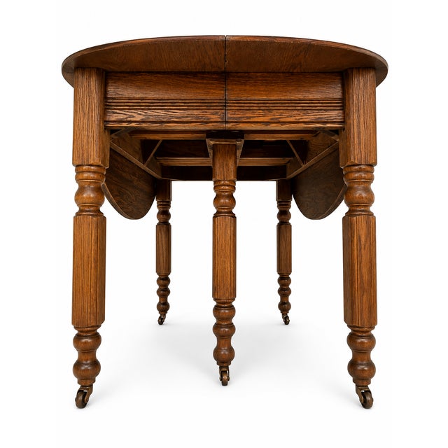 Antique Solid Oak Extension Dining Table With 6 Original Leaves & Original Wooden Casters Circa 1940s–1950s For Sale In Philadelphia - Image 6 of 7