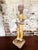 Figure of a Boy holding a dog. Figure looks like it was outside for a long time and elements wore away some of the paint...