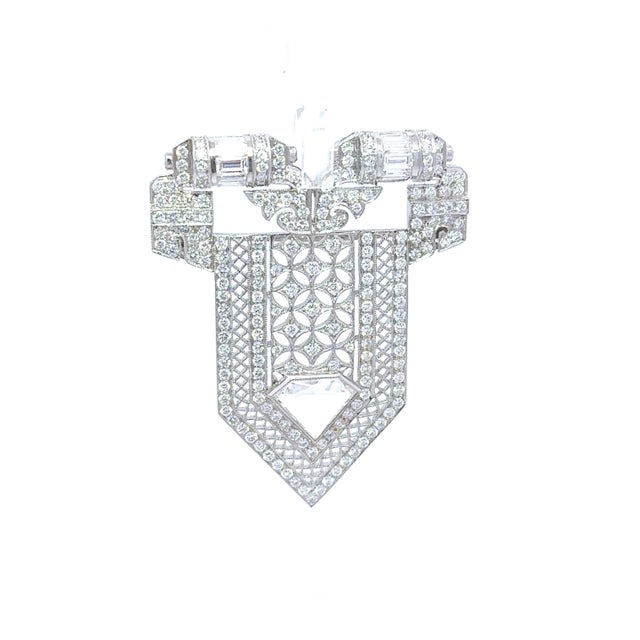 An stunning brooch designed in the Art Deco style features approximately 4.83 carats of mixed-cut white diamonds. The...