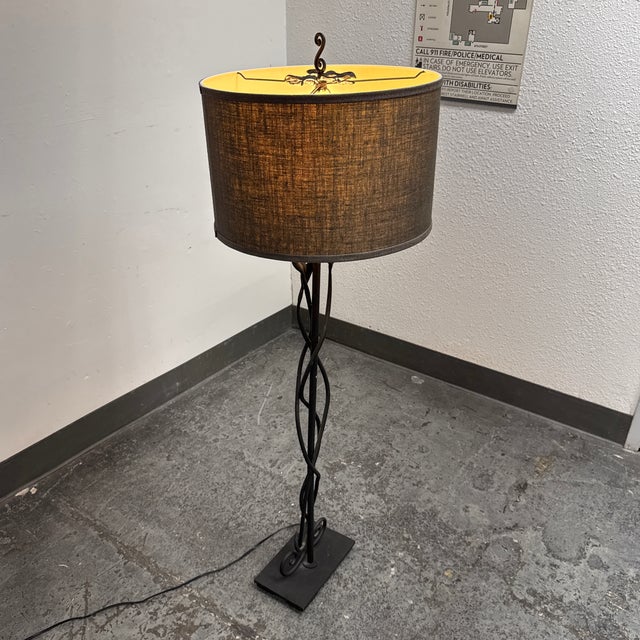 Design Plus Gallery presents the Sabina Wrought Iron Figural Floor Lamp from Pottery Barn. The lamp is formed in wrought...